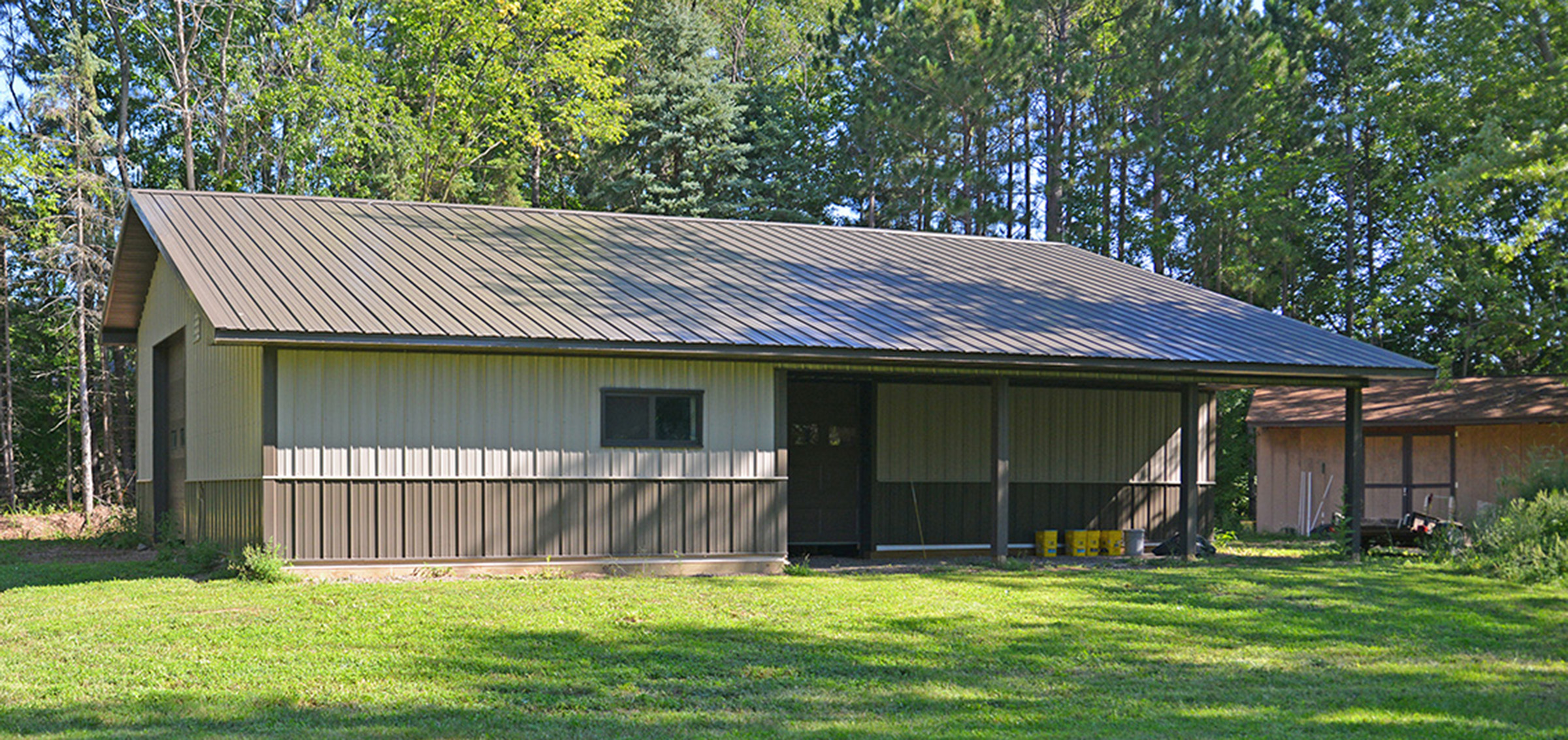 beige and brown post frame suburban building